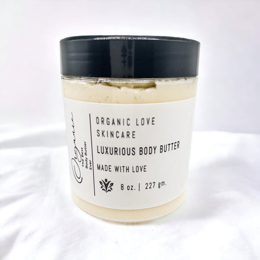 Jar of luxurious body butter with a black lid on a white background